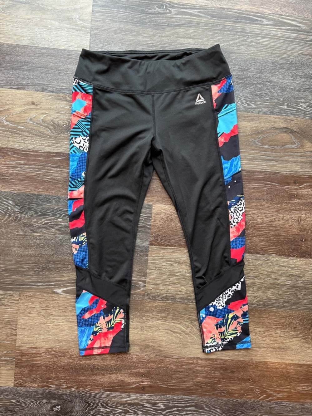 Reebok women’s ' Black Capri Leggings with Multicolor Side Panels mesh accent